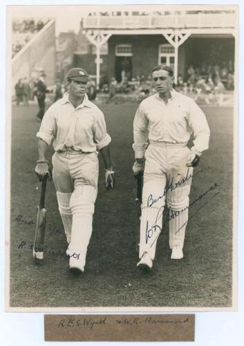 M.C.C. South African Touring Team v Lord Hawke’s XI, Scarborough 1930. Original mono photograph of R.E.S. Wyatt and Wally Hammond walking out to bat for M.C.C. in the match played at Scarborough, 6th- 9th September 1930, pavilion and spectators in the bac