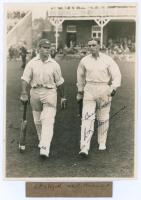 M.C.C. South African Touring Team v Lord Hawke’s XI, Scarborough 1930. Original mono photograph of R.E.S. Wyatt and Wally Hammond walking out to bat for M.C.C. in the match played at Scarborough, 6th- 9th September 1930, pavilion and spectators in the bac