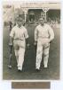 M.C.C. South African Touring Team v Lord Hawke’s XI, Scarborough 1930. Original mono photograph of R.E.S. Wyatt and Wally Hammond walking out to bat for M.C.C. in the match played at Scarborough, 6th- 9th September 1930, pavilion and spectators in the bac