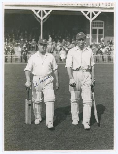 Arthur Wood. Yorkshire & England 1929-1946. Original mono photograph of Wood walking out to bat with Arthur Mitchell for Yorkshire at Scarborough in 1932, possibly the match v. M.C.C. 31st August- 2nd September 1932. The pavilion and spectators in the bac