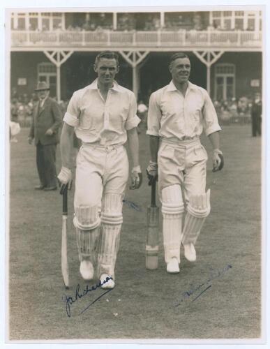 John Richardson and Brian Sellers. Yorkshire v. M.C.C. Scarborough 1936. Original sepia photograph of Yorkshire batsmen Richardson and Sellers walking out to bat, apparently at the start of the second day&rsquo;s play, the pavilion and stand at Scarborough with