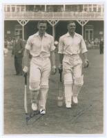 John Richardson and Brian Sellers. Yorkshire v. M.C.C. Scarborough 1936. Original sepia photograph of Yorkshire batsmen Richardson and Sellers walking out to bat, apparently at the start of the second day’s play, the pavilion and stand at Scarborough with