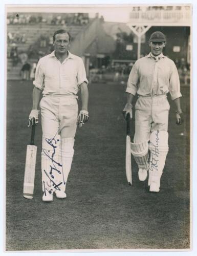 Tom Longfield and Errol Holmes. Yorkshire v. M.C.C. Scarborough 1936. Original mono photograph of M.C.C. batsmen Longfield and Holmes walking out to bat at Scarborough, the pavilion and grandstand with crowds in the background, for the match played 2nd- 4
