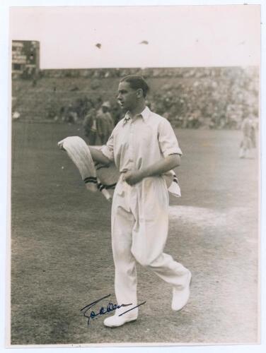 George Oswald Browning &lsquo;Gubby&rsquo; Allen. Middlesex, Cambridge University & England 1921-1950. Original mono photograph of Allen, full length on the outfield at Scarborough, wearing cricket attire and holding a sweater. Annotation in pencil to verso indicates