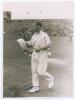 George Oswald Browning &lsquo;Gubby&rsquo; Allen. Middlesex, Cambridge University & England 1921-1950. Original mono photograph of Allen, full length on the outfield at Scarborough, wearing cricket attire and holding a sweater. Annotation in pencil to verso indicates