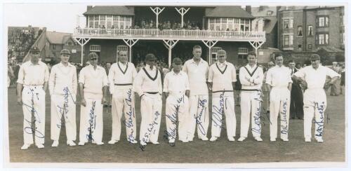 Yorkshire v. M.C.C. Scarborough 1937. Original mono photograph of the M.C.C. team lined up in front of the pavilion at Scarborough with crowds in the background for the match played 1st- 3rd September 1937. Fully and very nicely signed in ink by all eleve