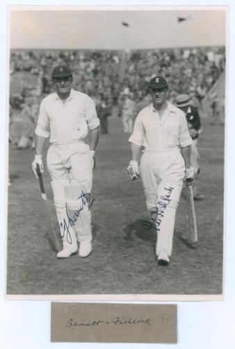 Charlie Barnett and Laurie Fishlock. H.D.G. Leveson-Gower&rsquo;s XI v. M.C.C. Australian Touring Team, Scarborough, 4th- 7th September 1937. Original mono photograph of the M.C.C. opening batsmen, Barnett and Fishlock walking out to bat, the packed stand in th