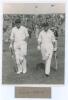 Charlie Barnett and Laurie Fishlock. H.D.G. Leveson-Gower&rsquo;s XI v. M.C.C. Australian Touring Team, Scarborough, 4th- 7th September 1937. Original mono photograph of the M.C.C. opening batsmen, Barnett and Fishlock walking out to bat, the packed stand in th