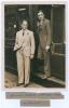 Herbert Sutcliffe. Yorkshire & England 1919-1945. Original sepia press photograph of Sutcliffe and Walter Hammond both wearing suits, standing at the door of a train at St. Pancras Station prior to travelling to Australia for the 1932/33 &lsquo;Bodyline&rsquo; tour. 