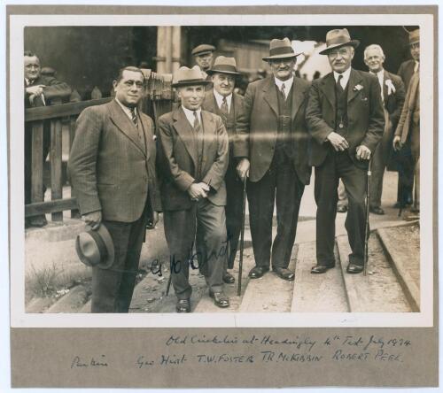 &lsquo;Old Cricketers at Headingley 4th Test July 1934&rsquo;. Original mono photograph of George Hirst reunited with other former cricketers at Headingley during the 1934 Ashes Test against Australia. The photograph, measuring 8.25&rdquo;x6&rdquo;, is laid to grey album page wi