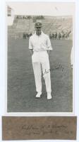 William Arthington Worsley. Yorkshire 1928-1929. Original mono real photograph plain back postcard of Worsley standing full length on the outfield at Scarborough, wearing cricket attire and Yorkshire cap. Nicely signed in black ink to the photograph by Wo