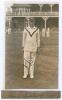 Frank Dennis. Yorkshire 1928-1933. Original sepia real photograph plain back postcard of Dennis standing full length on the outfield, wearing cricket attire and Yorkshire cap, the pavilion in the background. The photograph taken during the match Yorkshire