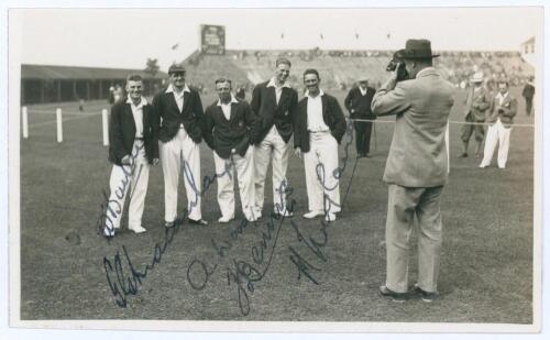 Yorkshire C.C.C. c.1929. Unusual original mono real photograph postcard of five members of the Yorkshire team for the match v M.C.C. at Scarborough, depicted standing on the outfield wearing cricket attire and blazers, having their photograph taken by a p