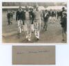 Gentlemen v Players. Scarborough 1934. Original mono real photograph postcard of Brian Sellers, John Human and Roger Winlaw wearing cricket attire and blazers, walking on the outfield at Scarborough surrounded by spectators and young autograph hunters. Ve