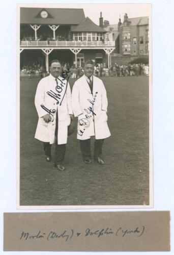 Arthur Morton and Arthur Dolphin c.1931. Original sepia real photograph postcard of the umpires, Arthur Morton (Derbyshire 1903-1926) and Arthur Dolphin (Yorkshire & England 1905-1927) walking on to the field at Scarborough in either 1931 or 1932. Nicely 