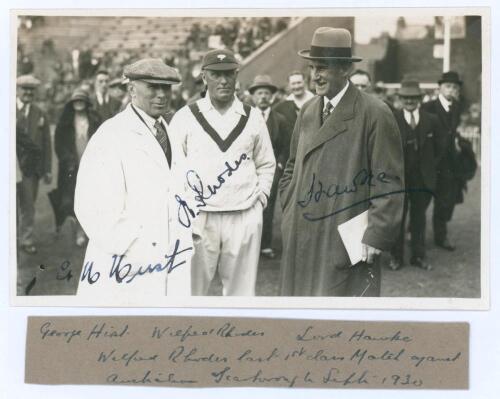 George Hirst, Wilfred Rhodes and Lord Hawke. Scarborough 1930. Nice original sepia real photograph postcard of Hirst wearing umpire’s attire, Rhodes in cricket attire and Yorkshire cap, and Lord Hawke in overcoat and trilby hat. Nicely signed in black ink