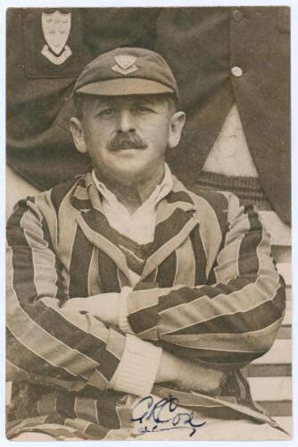 George Rubens Cox. Sussex 1895-1928. Original sepia press photograph of Cox seated half length wearing striped blazer and Sussex cap. The photograph by Sport & General measures 4&rdquo;x6&rdquo;. Signed in ink to the photograph by Cox. Ex J.W. Goldman collection. Lig
