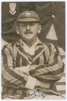 George Rubens Cox. Sussex 1895-1928. Original sepia press photograph of Cox seated half length wearing striped blazer and Sussex cap. The photograph by Sport & General measures 4”x6”. Signed in ink to the photograph by Cox. Ex J.W. Goldman collection. Lig