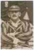 George Rubens Cox. Sussex 1895-1928. Original sepia press photograph of Cox seated half length wearing striped blazer and Sussex cap. The photograph by Sport & General measures 4&rdquo;x6&rdquo;. Signed in ink to the photograph by Cox. Ex J.W. Goldman collection. Lig