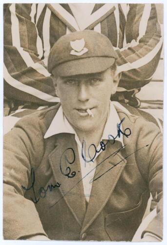 Thomas Edwin Reed &lsquo;Tommy&rsquo; Cook. Sussex 1922-1937. Original sepia press photograph of Cook seated half length wearing blazer and Sussex cap, cigarette in mouth. Nicely signed in black ink to the photograph by Cook. The photograph by Sport & General measure