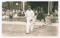 Thomas Francis ‘Frank’ Smailes. Yorkshire & England 1932-1948. Original sepia real photograph postcard of Smailes walking out to bat for Yorkshire at Scarborough in the match v M.C.C., 2nd- 4th September 1936. Very nicely signed in black ink to the photog