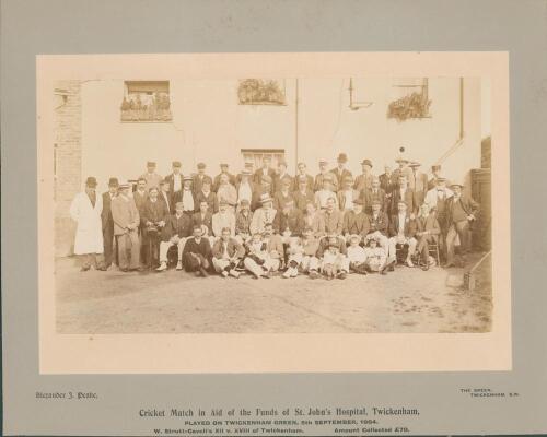 W.G. Grace. W. Strutt-Cavell&rsquo;s XI v XVIII of Twickenham&rsquo; 1904. Original sepia photograph of players, officials, dignitaries etc, seated and standing in rows wearing cricket attire, caps, blazers, boaters, bowler hats etc for the charity match played in ai