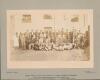 W.G. Grace. W. Strutt-Cavell&rsquo;s XI v XVIII of Twickenham&rsquo; 1904. Original sepia photograph of players, officials, dignitaries etc, seated and standing in rows wearing cricket attire, caps, blazers, boaters, bowler hats etc for the charity match played in ai