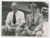 William Joseph &lsquo;Bill&rsquo; O&rsquo;Reilly. New South Wales & Australia 1927-1946 and Clarence &lsquo;Clarrie&rsquo; Victor Grimmett. Victoria, South Australia & Australia 1918-1941. Excellent informal mono press photograph of the two Australian Test players sitting in front of 