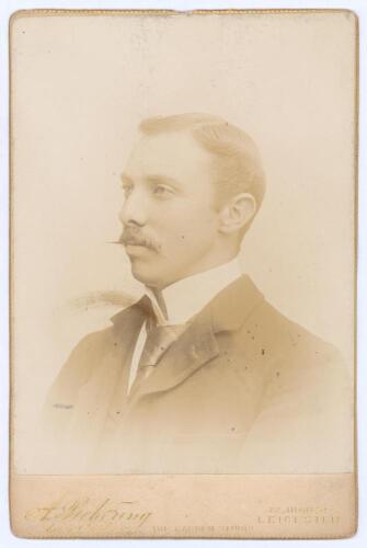 Alfred Edward Johns. Victoria 1894-1899. Sepia cabinet card photograph of Johns, head and shoulders, in formal wear wearing suit, dress shirt and tie. Cabinet card by A. Pickering of Leicester. Slight fading to image, very minor marks to image surface and