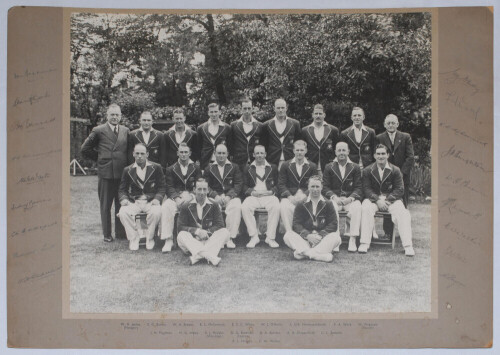 Australia tour to England 1938. Original large mono photograph of the Australian touring party seated and standing in rows wearing cricket attire and tour blazers. Fully signed to the mount borders by all eighteen members of the touring party. Players&rsquo;s s