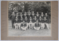 Australia tour to England 1938. Original large mono photograph of the Australian touring party seated and standing in rows wearing cricket attire and tour blazers. Fully signed to the mount borders by all eighteen members of the touring party. Players’s s