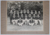 Australia tour to England 1938. Original large mono photograph of the Australian touring party seated and standing in rows wearing cricket attire and tour blazers. Fully signed to the mount borders by all eighteen members of the touring party. Players&rsquo;s s