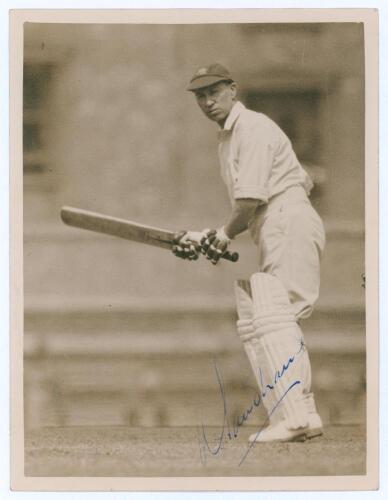 Andrew Sandham. Surrey & England 1911-1937. Original sepia press photograph of Sandham in batting action wearing his England cap. Very nicely signed in blue ink to the photograph by Sandham. Official stamp for Central Press Photos to verso. 6.5&rdquo;x8.5&rdquo;. Ver