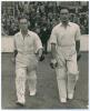 Middlesex C.C.C. 1947. Denis Compton and Bill Edrich. Large original mono press photograph of Compton and Edrich walking out to bat in 1947. Signed in ink to the photograph by both players. Central Press Photos, London. 8&rdquo;x10&rdquo;. Small wear to lower right c