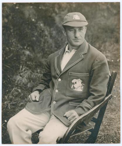 Alfred Percy &lsquo;Tich&rsquo; Freeman. Kent & England 1914-1936. Large original mono photograph of Freeman three quarter length wearing M.C.C. tour cap and blazer, seated in a garden chair. The photograph by B. & W. Fisk-Moore of Canterbury, laid to tightly trimmed