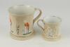 Cricket mugs. Two similar Staffordshire waisted mugs with strap handles and beaded rims. With three relief moulded figures of a batsman, bowler and wicket keeper, believed to be Lillywhite, Pilch and Box. Floral silver lustre decoration between figures, c - 2