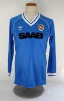 Ian Botham. Manchester City football shirt worn by Ian Botham in a Charity match in the early 1980&rsquo;s. The long sleeved light blue, with white trim to neck and cuffs, Umbro shirt with Manchester City emblem and shirt sponsor &lsquo;SAAB&rsquo; to chest. Number &lsquo;9&rsquo; to 