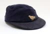 Sussex navy blue 2nd XI cloth cricket cap worn by Robin Marlar during his playing career. The cap, by W.V. Brown of Eton, embroidered with the single martlet emblem of Sussex to front. The cap is worn and a little faded, with odd faults, odd moth hole etc
