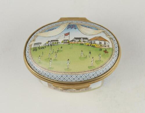 &lsquo;Bicentenary of the M.C.C.&rsquo;. Halcyon Days oval enamelled pill box. The lid with a cricket match at Lord&rsquo;s, the hinged lid revealing title &lsquo;To commemorate the Bicentenary of the Marylebone Cricket Club 1787-1987&rsquo; and small vignette of Thomas Lord. The oute