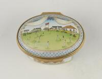 &lsquo;Bicentenary of the M.C.C.&rsquo;. Halcyon Days oval enamelled pill box. The lid with a cricket match at Lord&rsquo;s, the hinged lid revealing title &lsquo;To commemorate the Bicentenary of the Marylebone Cricket Club 1787-1987&rsquo; and small vignette of Thomas Lord. The oute