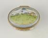 &lsquo;Bicentenary of the M.C.C.&rsquo;. Halcyon Days oval enamelled pill box. The lid with a cricket match at Lord&rsquo;s, the hinged lid revealing title &lsquo;To commemorate the Bicentenary of the Marylebone Cricket Club 1787-1987&rsquo; and small vignette of Thomas Lord. The oute