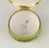 &lsquo;Cricket at Lord&rsquo;s&rsquo;. Halcyon Days circular enamelled pill box. The lid with scene of Lord&rsquo;s at the beginning of the 19th Century, the hinged lid revealing title &lsquo;Cricket at Lord&rsquo;s in the early 19th Century&rsquo; and small vignette of a cricketer in top hat. T - 2
