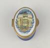 &lsquo;NatWest Bank Trophy Final 1983&rsquo;. Halcyon Days oval enamelled pill box. The lid with scene of the NatWest Tower, the hinged lid revealing title &lsquo;NatWest Bank Trophy Final 1983&rsquo;&rsquo;. The outer decorated in cobalt blue Stamped to base &lsquo;Bilston & Battersea Enam
