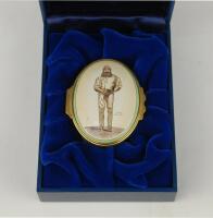 &lsquo;W.G. Grace&rsquo;. Halcyon Days oval enamelled pill box. The lid decorated with full length figure of Grace by &lsquo;Spy&rsquo;, biographical details of Grace to the inside of the lid, the inside base with inscription, &lsquo;W.G. Grace, 1848-1915. Hero of English Cricket&rsquo;. St