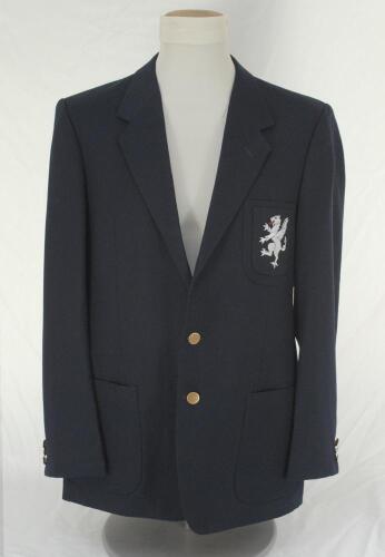 Ian Terence Botham. Somerset navy blue blazer worn by Ian Botham during his playing career with the club. The blazer by &lsquo;Van Heusen of Saville Row&rsquo; with embroidered white Somerset dragon with red tongue emblem applied to blazer breast pocket. Sold with a