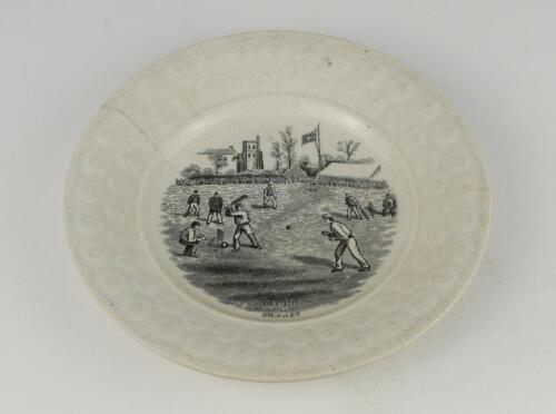 Victorian cricket plate. A 19th Century Staffordshire plate with transfer printed decoration centre of a cricket match in progress in black, with tents, a flag, church and large crowd to the background. Title &lsquo;Cricket&rsquo; printed to lower edge under the imag
