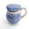 Staffordshire shaving mug. Victorian Staffordshire shaving mug and ceramic cover (lid) with strap handle, transfer printed in blue, with a cricket scene of batsman, wicket-keeper and two fielders with pavilion and trees to background. To verso, a football