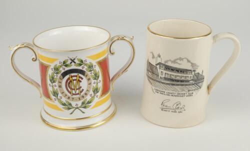 M.C.C. Bicentenary 1787-1987. Spode china two handled loving tankard with decoration and titles to front and back, gold lustre to handles, rim, and base. 4.5&rdquo; tall. Very good condition. Sold with a further Sandland one pint ceramic tankard produced to com