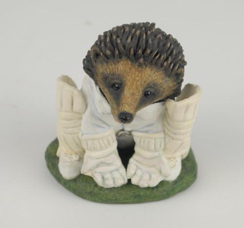 &lsquo;The Hedgehog Wicket-keeper&rsquo;. A handmade and painted figure of a hedgehog in cricket attire in wicket keeper pose crouching and awaiting the ball. 3.5&rdquo; tall. Makers mark and date &lsquo;04&rsquo; impressed to base. A excellent detailed figure. This is an original uni