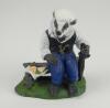 &lsquo;The Badger Spectator&rsquo;. A handmade and painted figure of a ageing badger sitting on a bench, with knotted handkerchief on his head, eating his lunch and holding an umbrella. 5.25&rdquo; tall. No Makers mark and date apparent to base. A excellent detailed figure